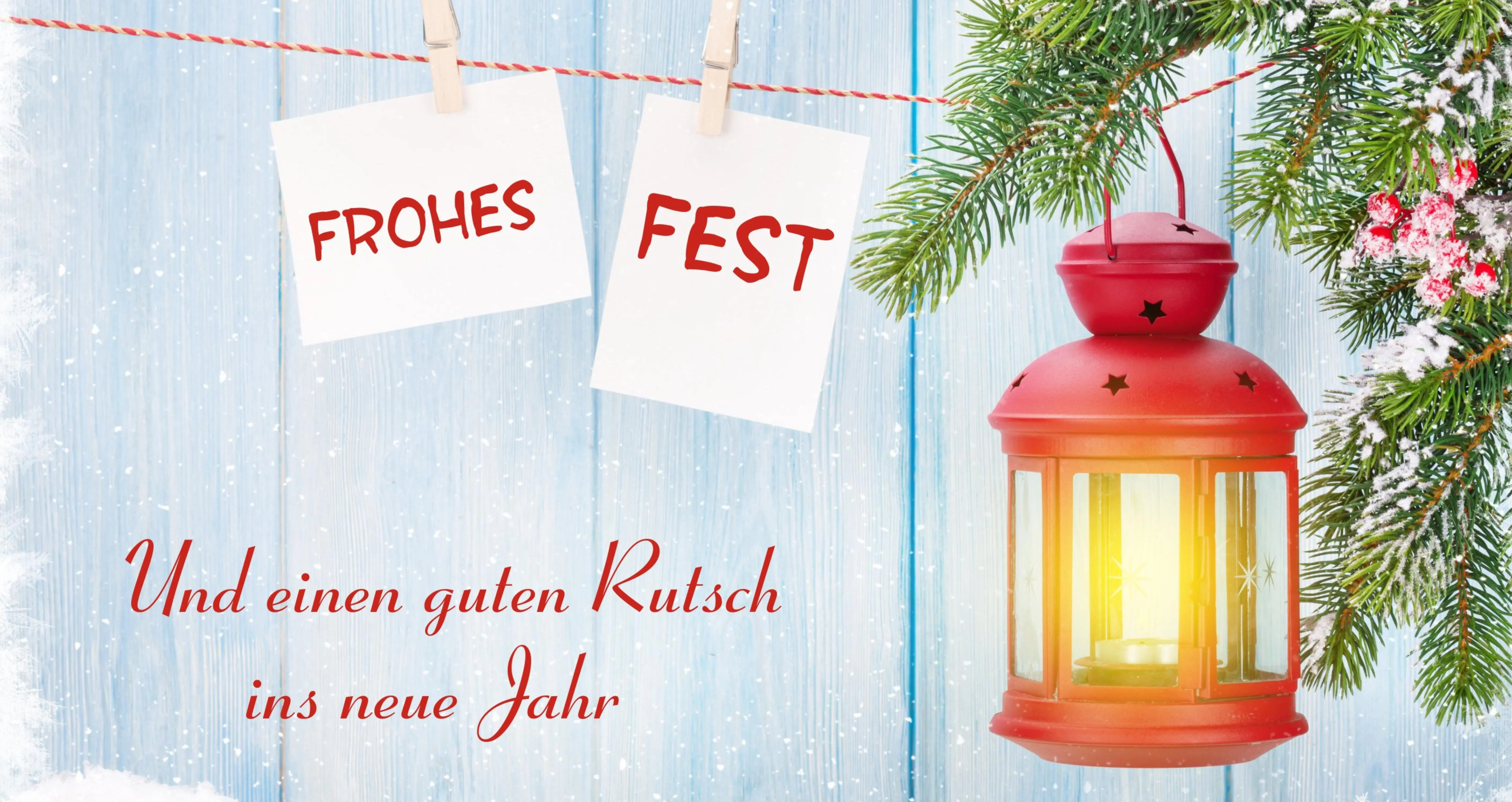 Kleine rote Laterne mit Weihnachtsgruß
